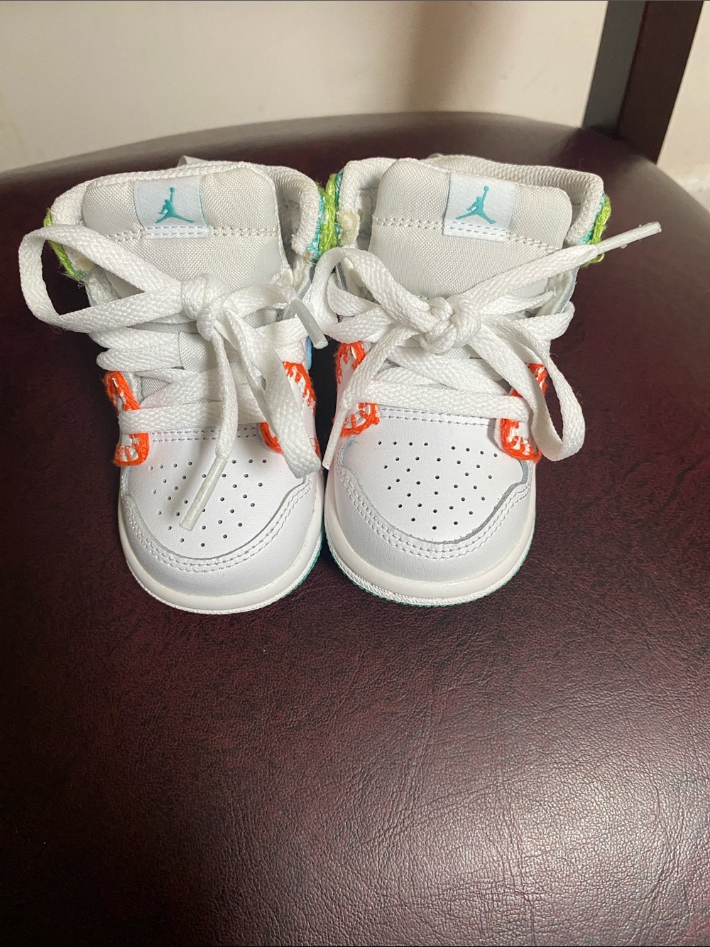 Nike White Toddler Sneakers with Teal and Orange Accents